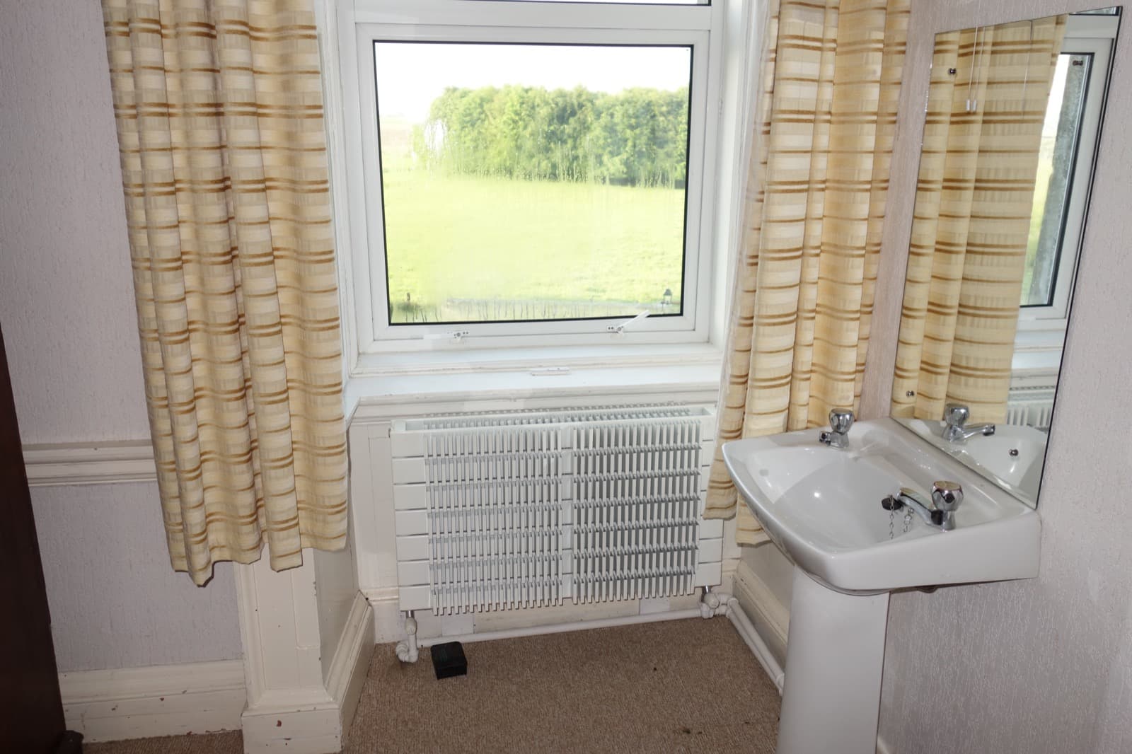 Original bathroom overlooking the pasture